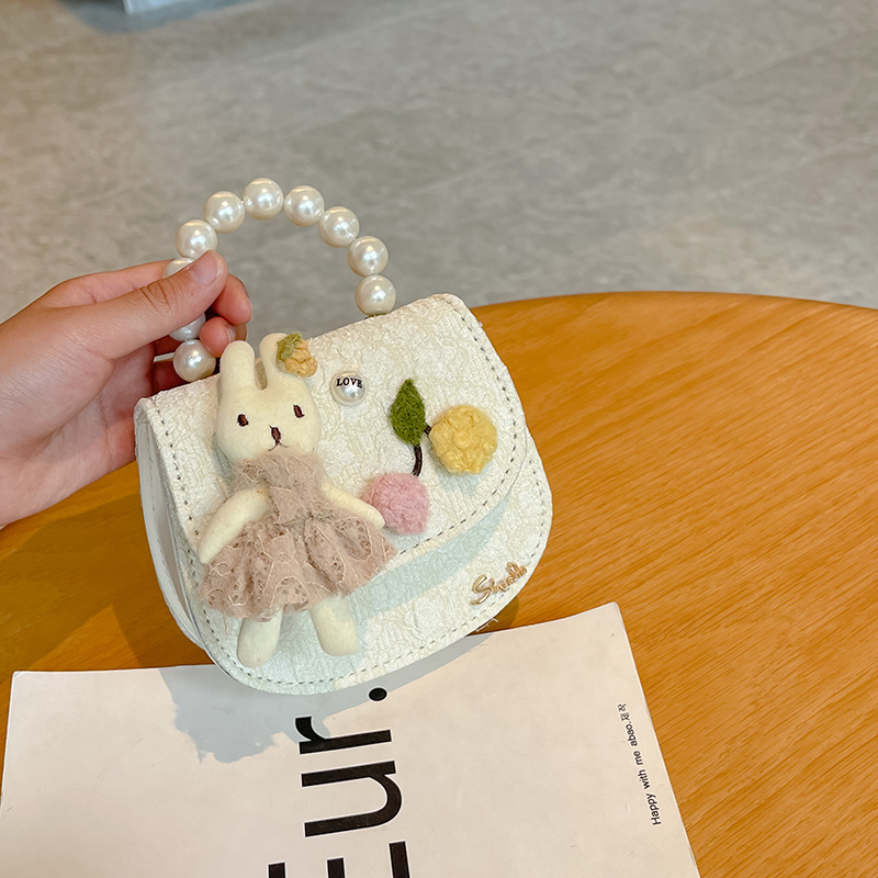 Bolso oblicuo de los niños de estilo coreano princesa estilo occidental bolso de hombro de dibujos animados conejito perla bolso niñas fuera monedero