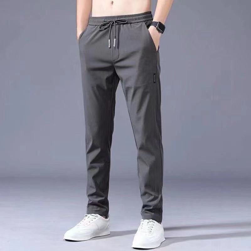 Pantalones casuales de los hombres rectos slim fit verano fino elástico cinturón elástico pantalones sueltos más tamaño entrega de una sola pieza
