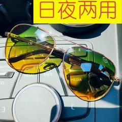 偏光昼と夜の両用変色サングラス夜視鏡運転手が運転しています。