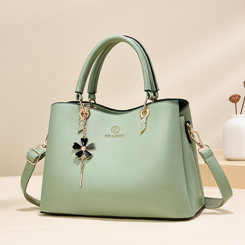 Colgante de flores bolsas de mano de color sólido de gran capacidad de moda versátil bolsas de hombro ocio de viaje oblicuo bolsas transfronterizas