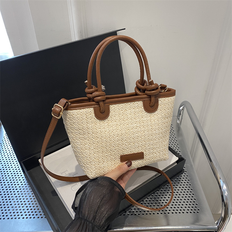 Bolso tejido de paja estilo playa de vacaciones de verano bolso de mensajero portátil 2024 nuevo estilo nudo de cuerda de aire extranjero bolso de canasta de verduras bolso tejido