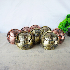 Factory-wholesale spherical plum, orchid, bamboo, and chrysanthemum metal ashtrays—windproof, smoke-resistant home decor items perfect as gifts for friends and family.
