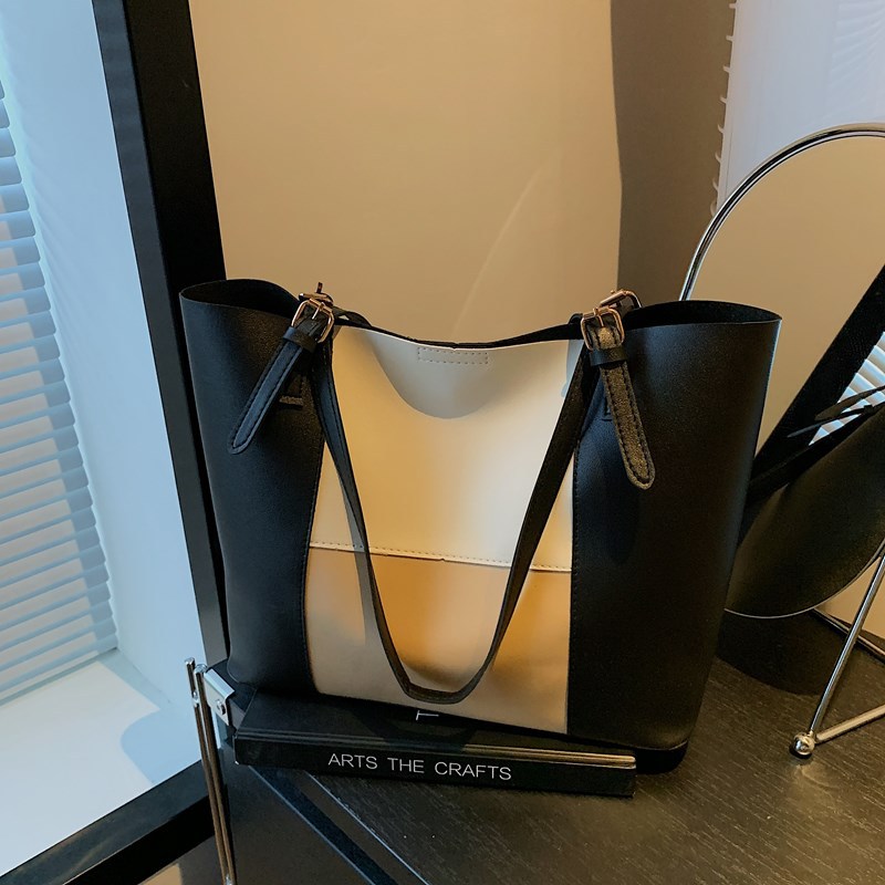 Bolso de cercanías atmosférico para mujer, estilo occidental de gran capacidad 2025 verano nuevo estilo retro simple bolso portátil de un solo hombro para mujer