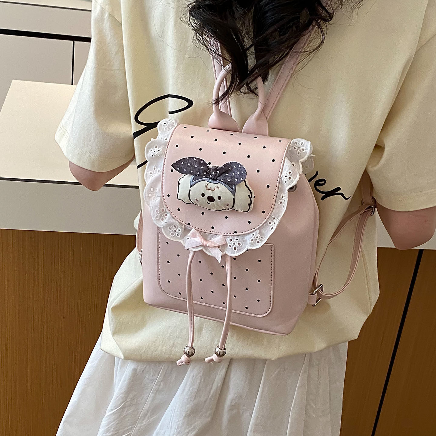 Mochila casual mochila de verano dibujos animados 2026 encaje versátil mochila escolar de mujer de viaje nuevo lindo punto de onda popular
