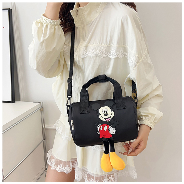 The 2021 new children's bags feature a cute Mickey Mouse pattern bowling bag for girls and a fashionable hand-held shoulder bag undefined