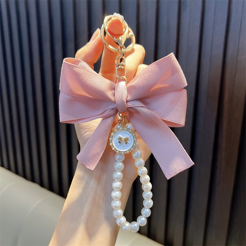 Perlas hechas a mano llaveros de perlas mujeres arco de correa de color bolsos colgantes pequeños regalos al por mayor
