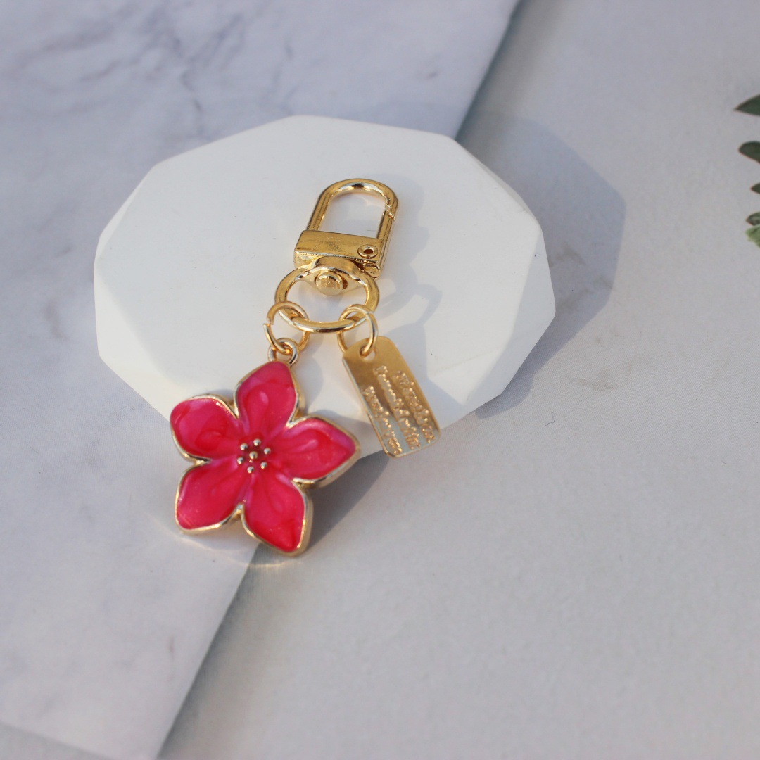 Nueva venta caliente transfronteriza, estilo caliente, flor de cinco hojas coreana, flor de pera, colgante, llavero, bolso Zou Ju, colgante, regalo pequeño