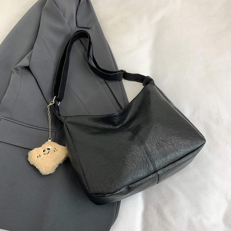 Bolso de cuero suave versátil para damas 2024 nuevo estilo retro moda bolso universitario gran capacidad de ocio