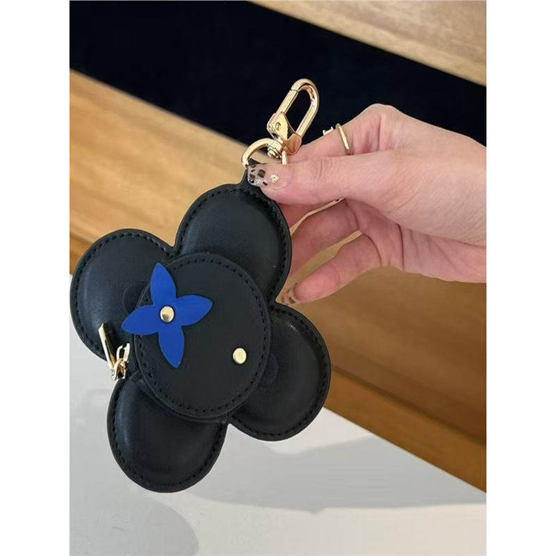 2025 nuevo solar flor de llaves bolsas de monedas bolsas de nicho de cuero bolsas colgantes bolsas de polvo de auriculares