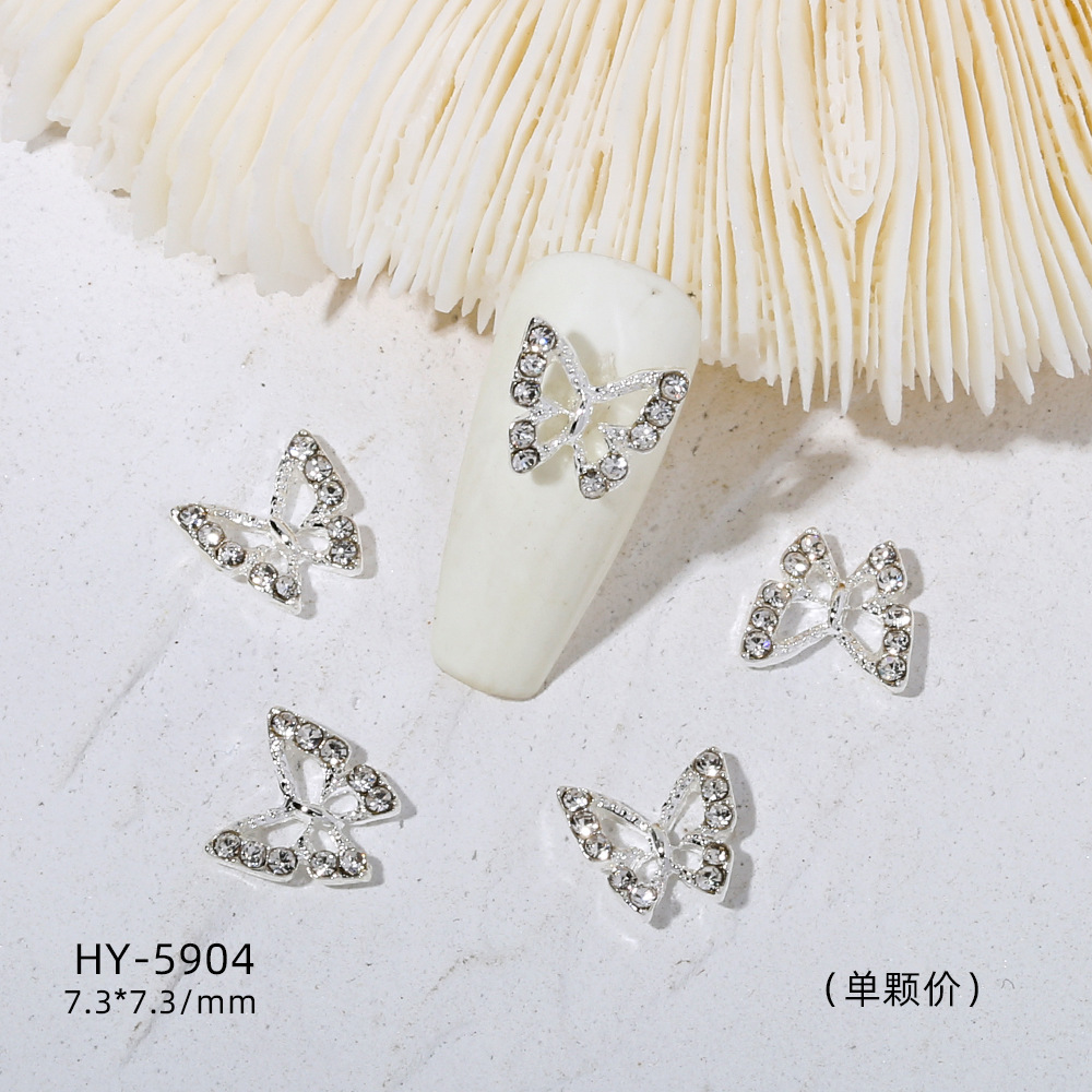 Venta caliente taladro de uñas arco de plata joyería tridimensional flash diamante esmalte de uñas decorativo diamante acabado pieza de uñas traje de joyería