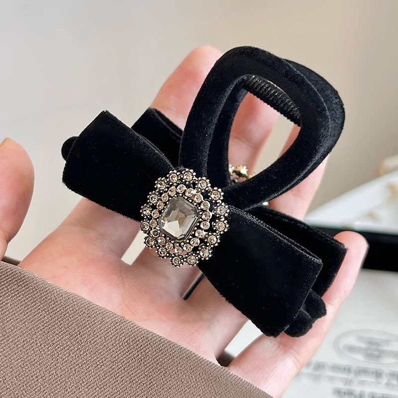 Flocking black rhinestone bow medium clip 8cm