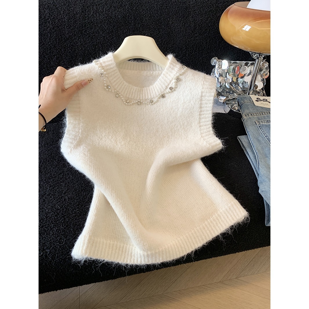 Knitted autumn vest with a round collar