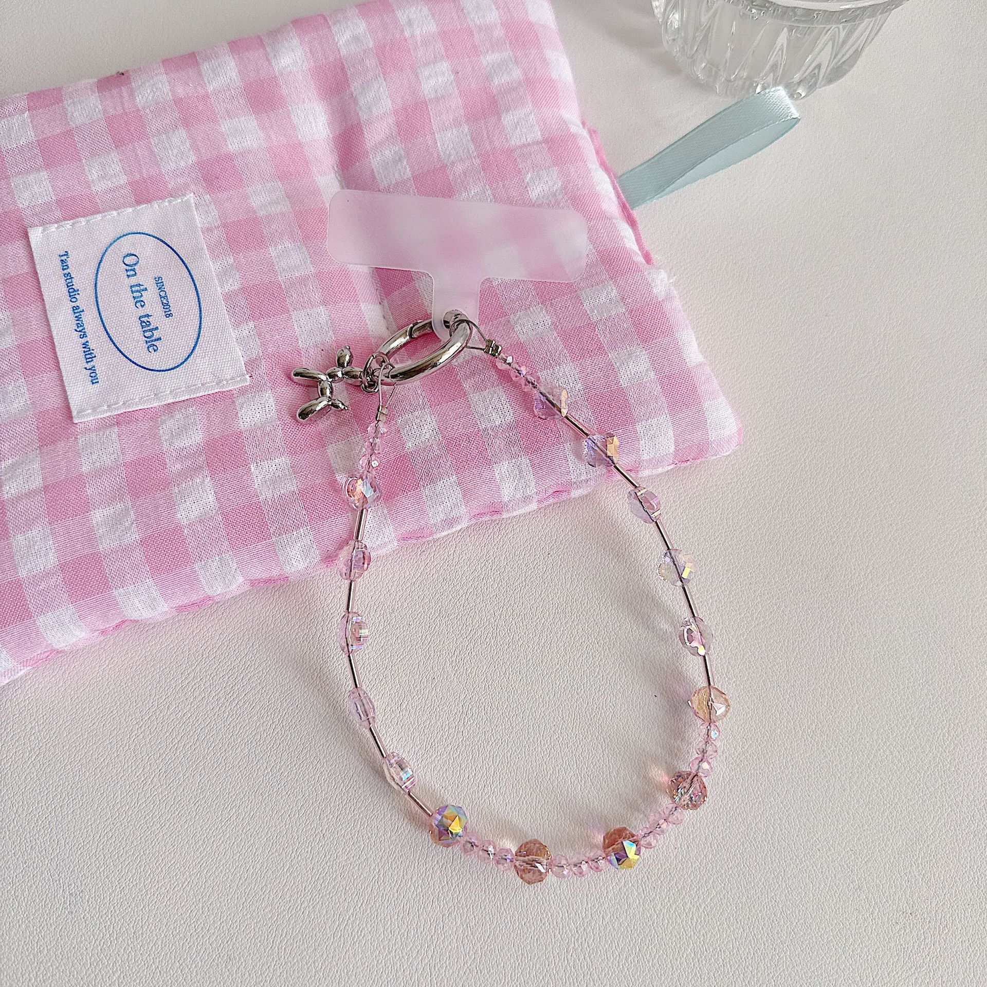 Boutique hecho a mano de alta gama para teléfono móvil cadena de muñeca de trébol de cuatro hojas de cristal original cadena de teléfono móvil de moda cuerda corta