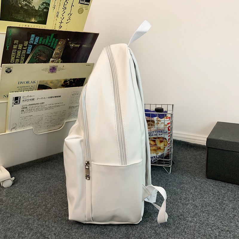 2023 nueva mochila de cuero suave de pareja de gran capacidad casual simple y versátil mochila escolar de computadora de viaje al aire libre al por mayor