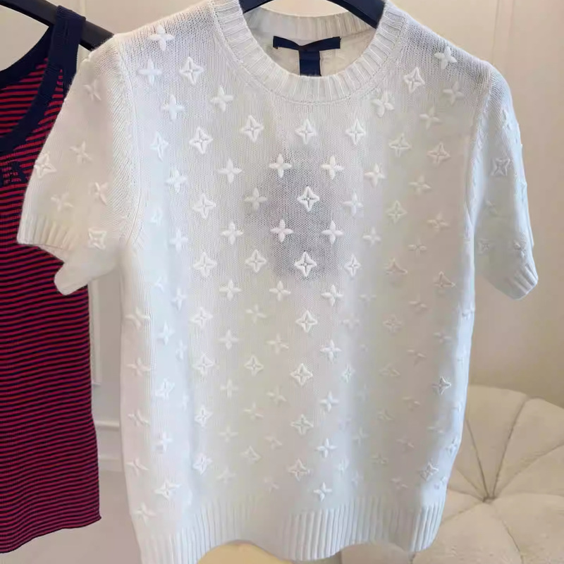 Nanyou Haute Couture 26Th Summer Collection: Elegant, Slightly Transparent, Thin Knit Short-Sleeve Women's Sweater with Monogram Lettering in Wool Blend Nanyou Haute Couture 26Th Summer Collection: Elegant, Slightly Transparent, Thin Knit Short-Sleeve Women's Sweater with Monogram Lettering in Wool Blend