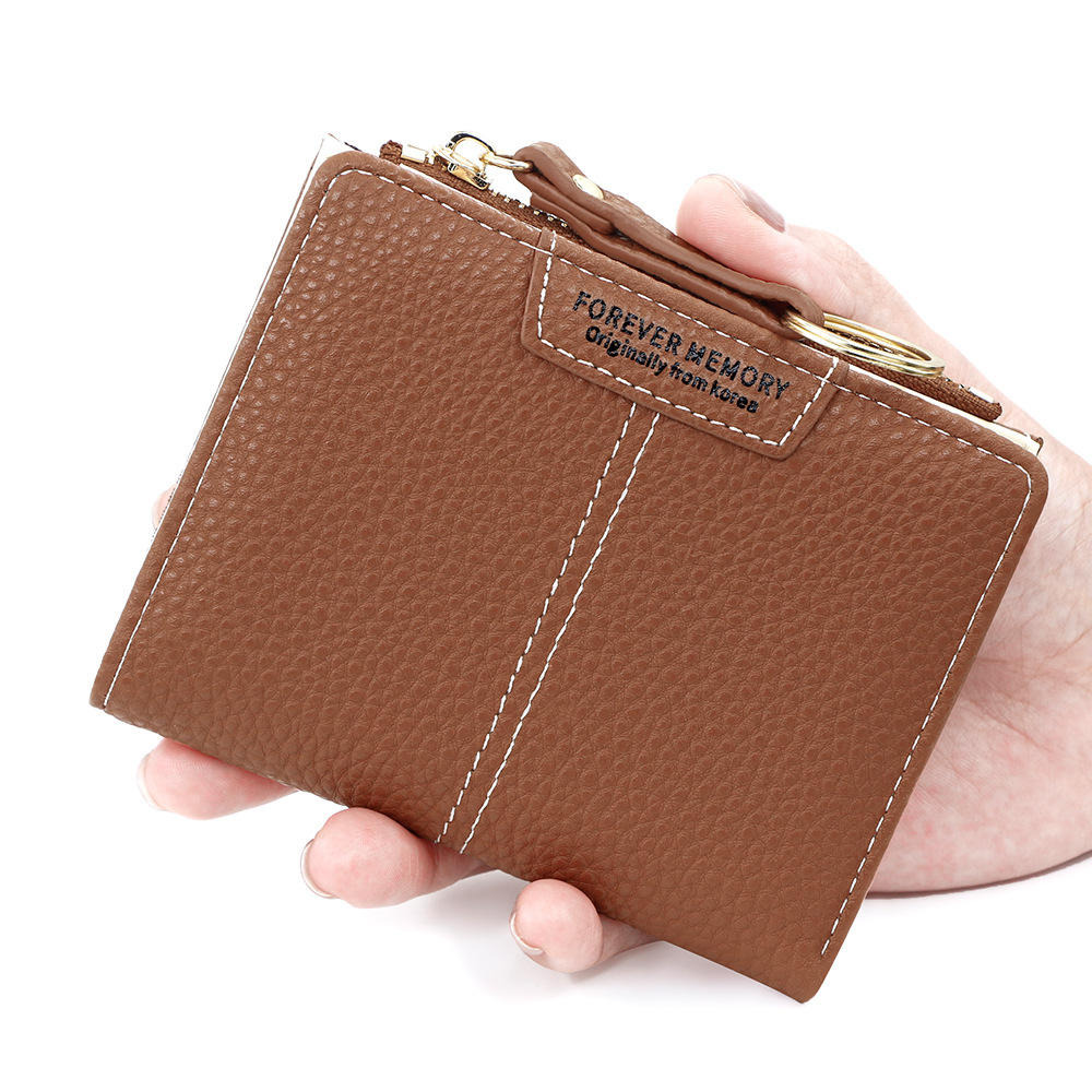 Versión coreana de la nueva billetera corta para mujer, llavero simple, billetera de monedas, billetera de dos pliegues para estudiantes al por mayor