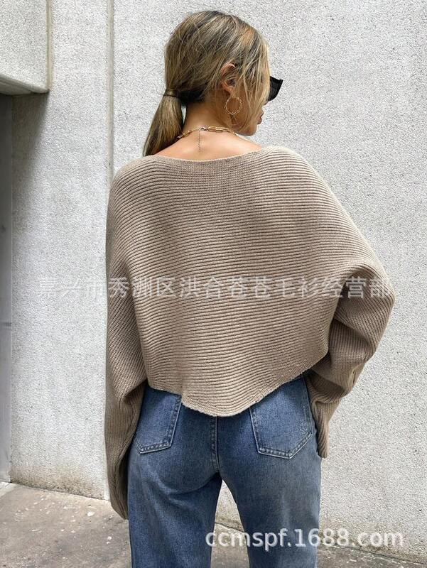 2023秋冬の新型日韓の不規則なニットのセーターの女性のデザイン感の小さい大衆の交差するニットの大きいサイズの婦人服|undefined