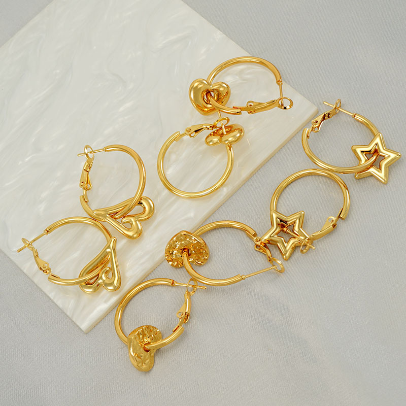 2023 nuevos pendientes de corazón de melocotón de oro 18K transfronterizos femeninos de acero inoxidable europeo y americano diseño hueco pendientes de estrella de amor femenino