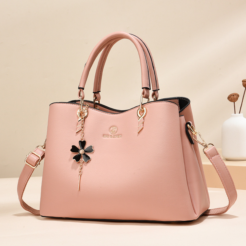 Colgante de flores bolsas de mano de color sólido de gran capacidad de moda versátil bolsas de hombro ocio de viaje oblicuo bolsas transfronterizas
