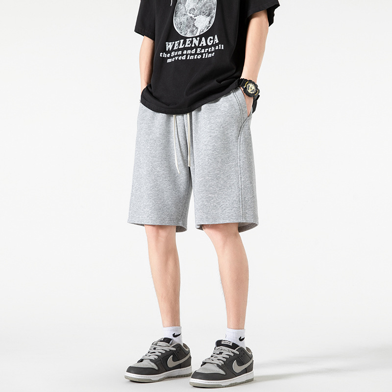 Pantalones cortos deportivos de punto de algodón chino 2025 nuevos productos de verano estilo básico calle sueltos pantalones de cinco puntos de marca de moda americana