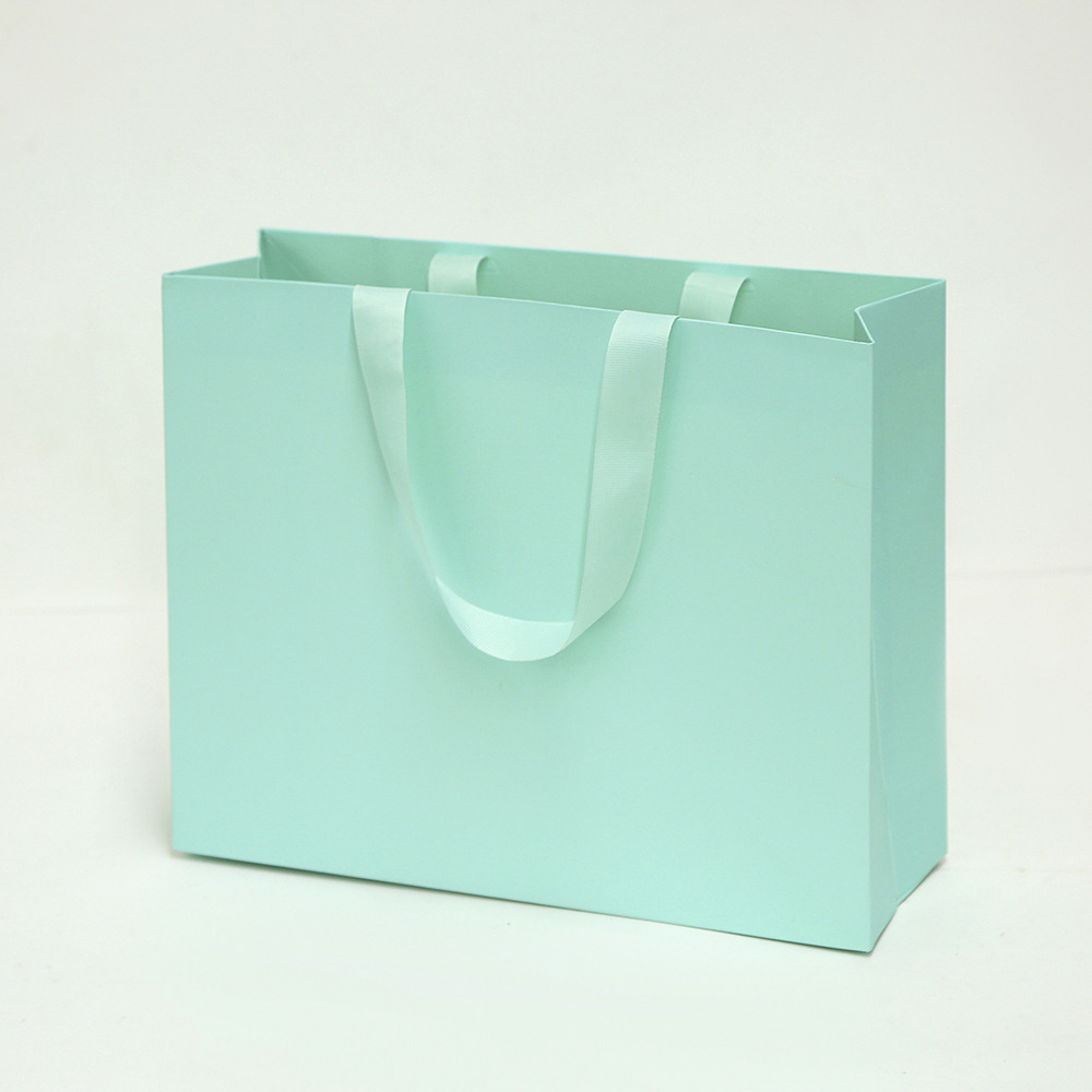 Bolsa de cartón blanco logotipo tienda de ropa bolsa de mano bolsa de regalo espesa bolsa de regalo de Navidad se puede imprimir