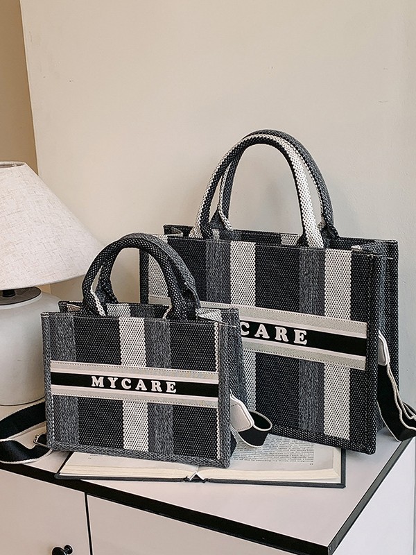 Bolso portátil de alta gama a rayas con sentido al por mayor transfronterizo logotipo personalizado nuevo casual todo-fósforo bolso de mensajero de gran capacidad