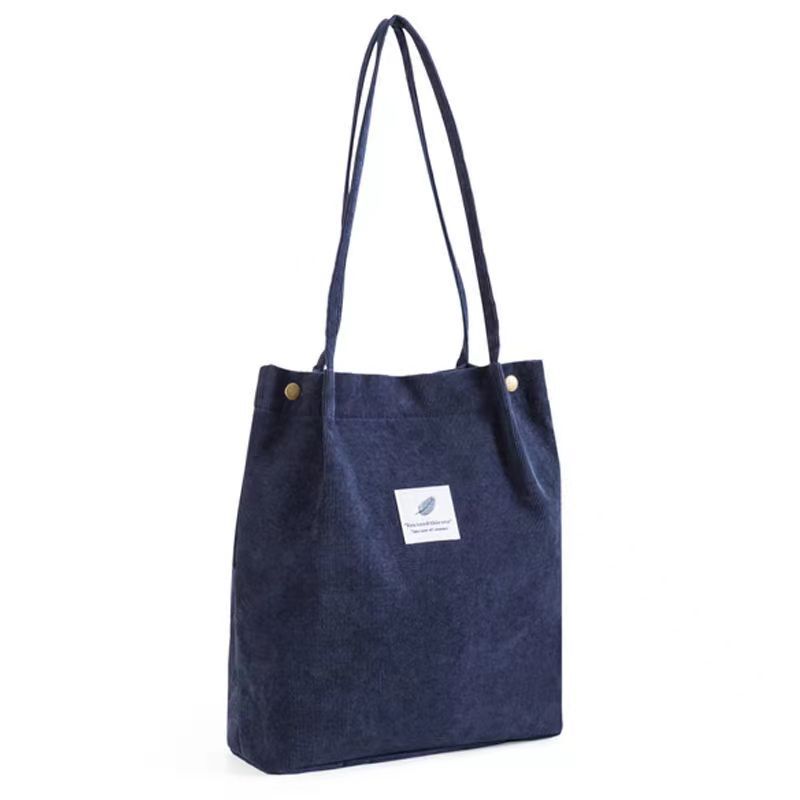 Versión coreana del bolso de lona de pana, bolso de almacenamiento portátil, bolso femenino, bolso de hombro de todo fósforo literario de gran capacidad, spot femenino al por mayor