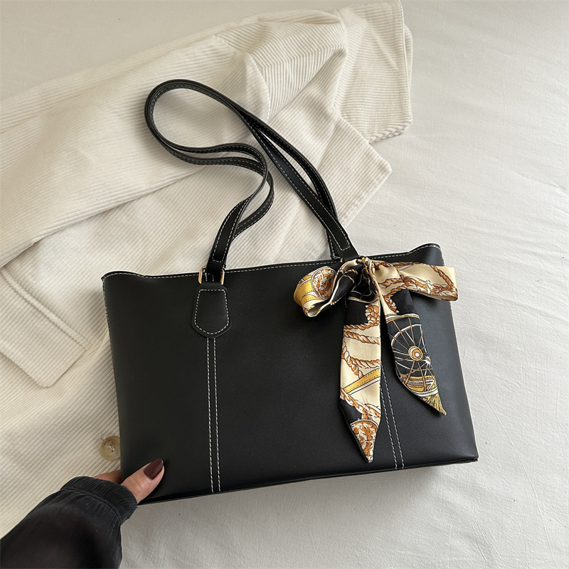 Retro alta sensación de bolso de viaje 2025 primavera y verano nuevo estilo versátil ins bolso de hombro de trabajo de color sólido bolso especial