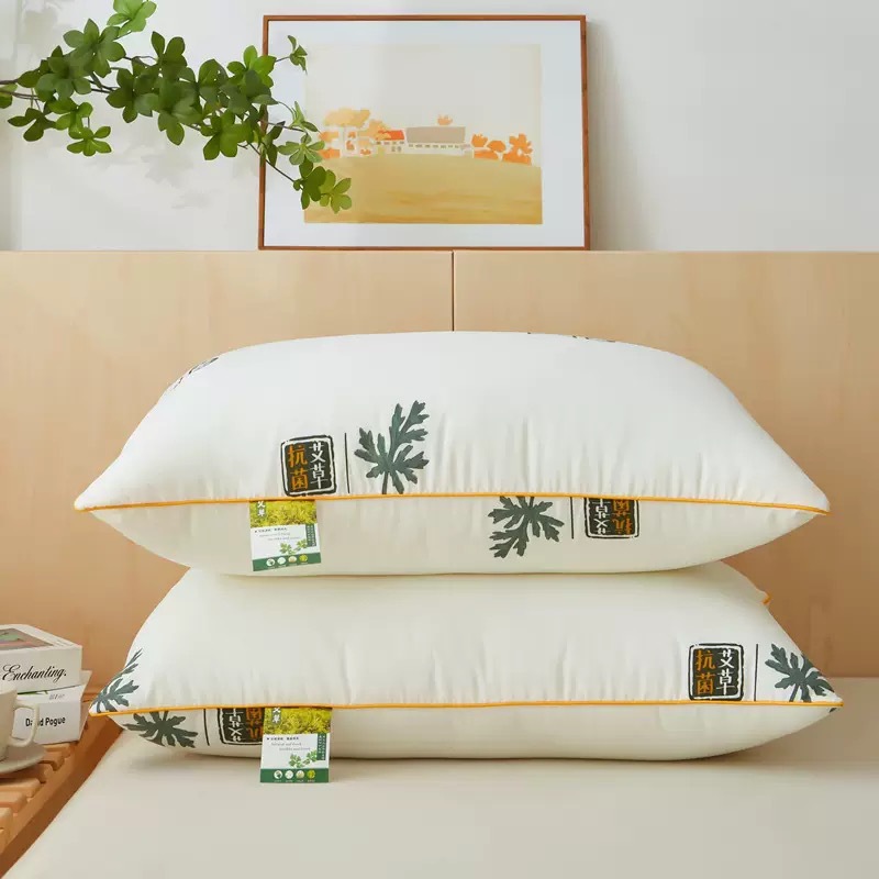 Almohadas al por mayor del fabricante, nuevo modelo de almohada cervical de terciopelo con plumas antibacterianas de artemisa para uso en el hogar, hoteles, estudiantes y adultos.