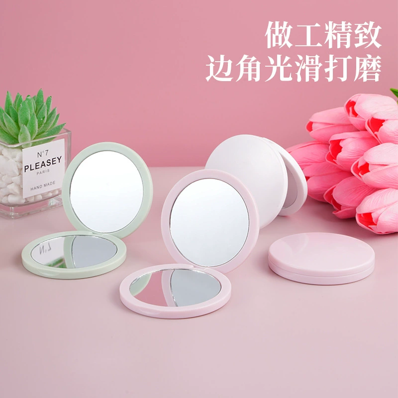 Folding handheld round mirror, double-sided plastic 7.2 cm, magnetic, 2× magnification