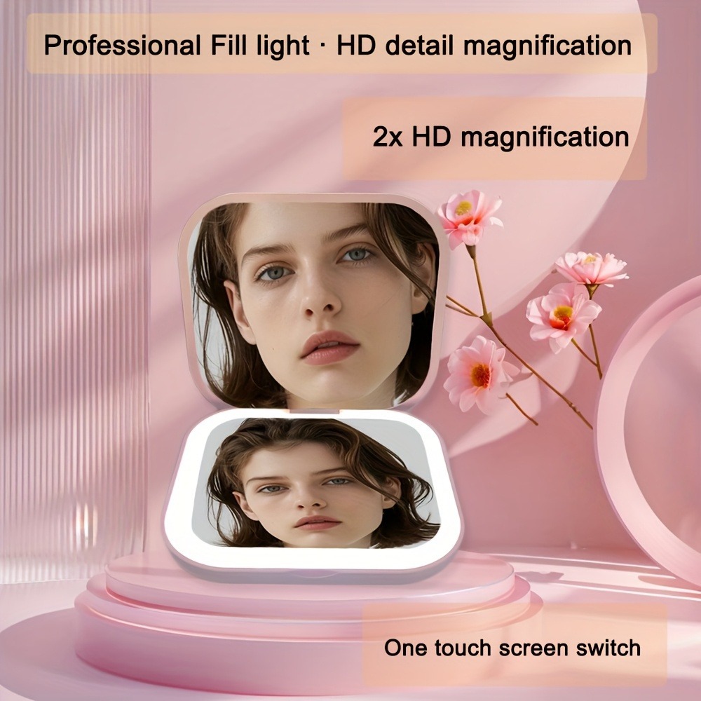 Venta directa de fábrica Espejo de maquillaje Regalo portátil Espejo de maquillaje de mano plegable con luz de carga Modelo avanzado transfronterizo