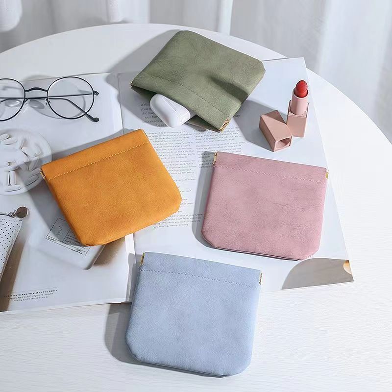 Leather shrapnel bag can be opened and closed to store data cable earphone charging treasure perfume lipstick packaging bag dust bag