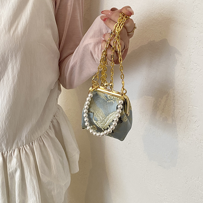 Nuevo bolso de perla dulce chino para chicas, bolso de cadena de flores nacionales, bolso mini compacto para niños.
