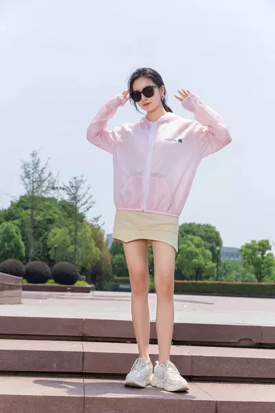 Pink in front of the four leaf grass
