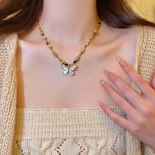 Bohemian-style butterfly necklace for women, featuring a new Chinese retro bead sweater vest chain, a niche temperament necklace.