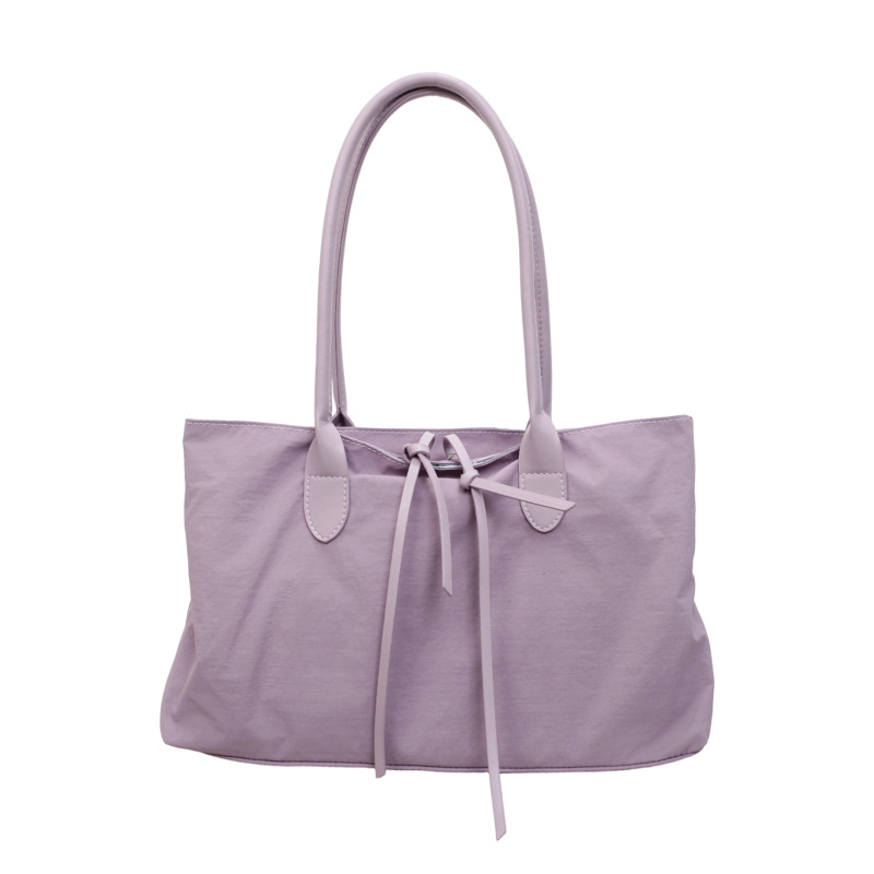 2026 nuevo paquete de moda de tela de alta capacidad, bolso de hombro de alta calidad, bolso de bolsillo pequeño y multifuncional.