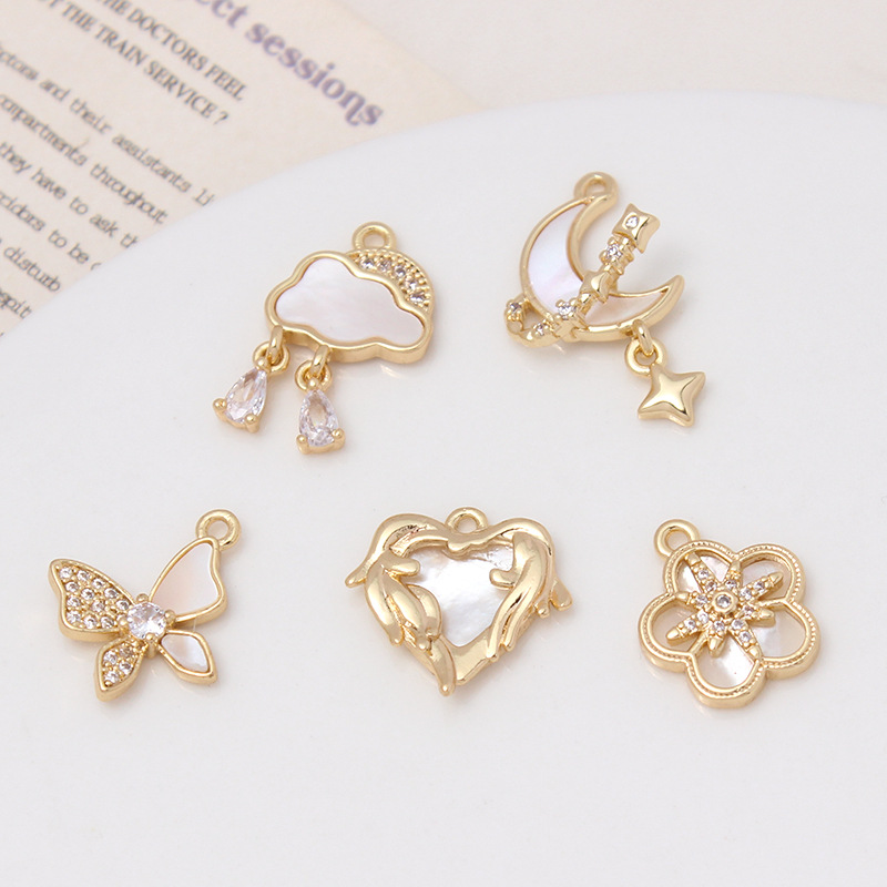 保色メッキ真金insは天然貝殻月の雲をはめ込んでいます。