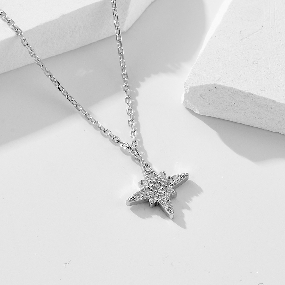 Nuevo estilo completo diamante ocho Awn estrella collar de plata pura mujer europea y americana ins nicho diseño versátil colgante de cadena de clavícula de alto grado