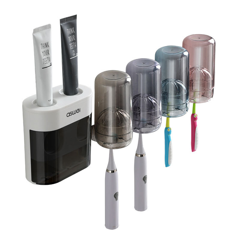 En stock venta al por mayor cepillo de dientes rack Punch-libre montado en la pared hogar Baño creativo automático pasta de dientes exprimidor