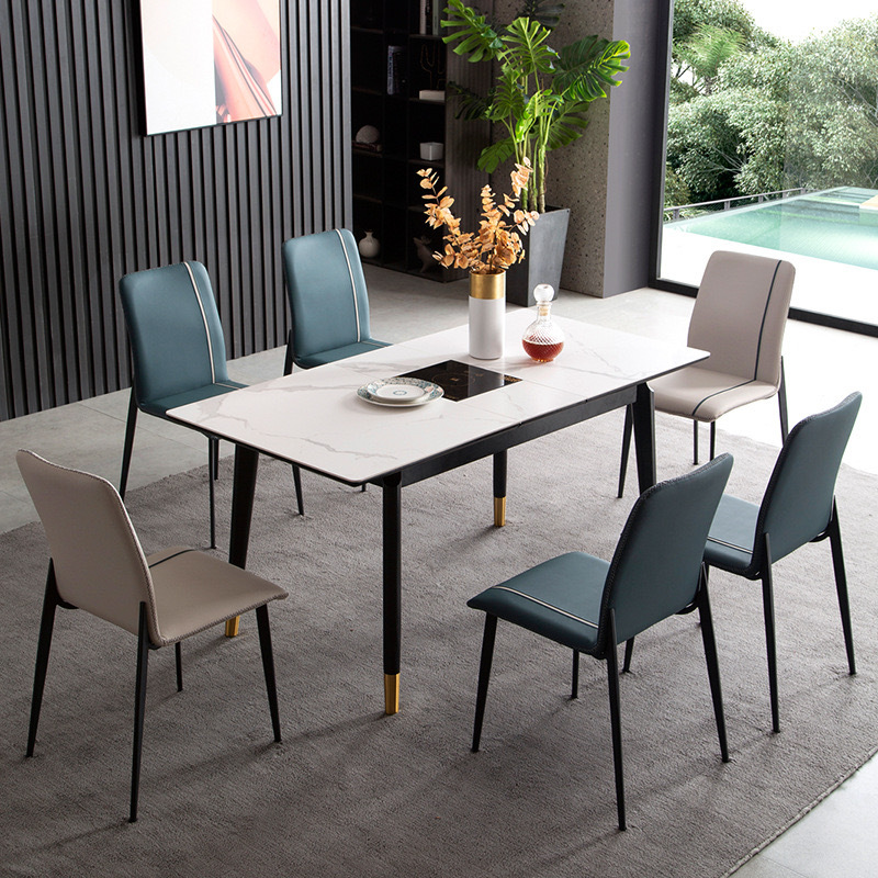 Mesa y silla de comedor de tabla de roca ligera de estilo italiano de lujo, combinación de mesa y silla de comedor de apartamento rectangular moderno y simple.