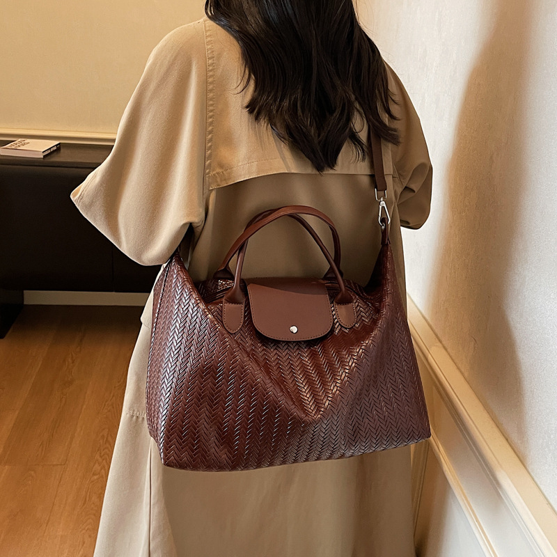 Bolsa de viaje de gran capacidad retro herringbone transfronteriza, bolsa de ejercicios deportivos al aire libre para mujeres, bolsa de hombro de un solo hombro.