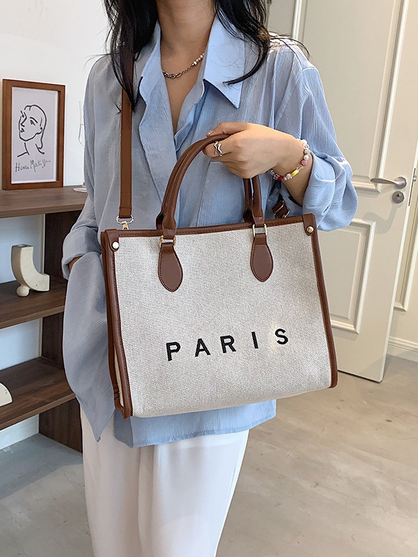 Bolsos para mujer, estilo nuevo transfronterizo, bolso tote de lona con letras bordadas, bolso de hombro cruzado informal de alta gama para ir al trabajo