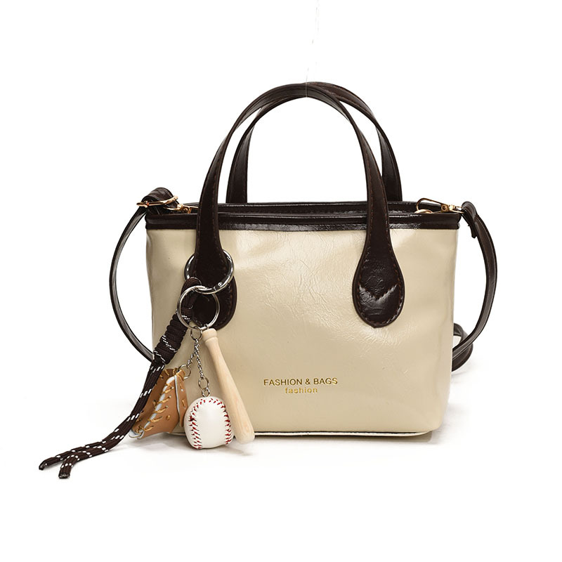 Bolso de cubo de textura de color sólido para mujer 2025 primavera nueva moda bolso de mensajero coreano estilo occidental de alta gama para mujer