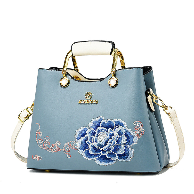 Regalo de temperamento de nicho para mamá 2025 nuevo estilo para suegra y ancianos bolso de hombro bordado elegante y de moda