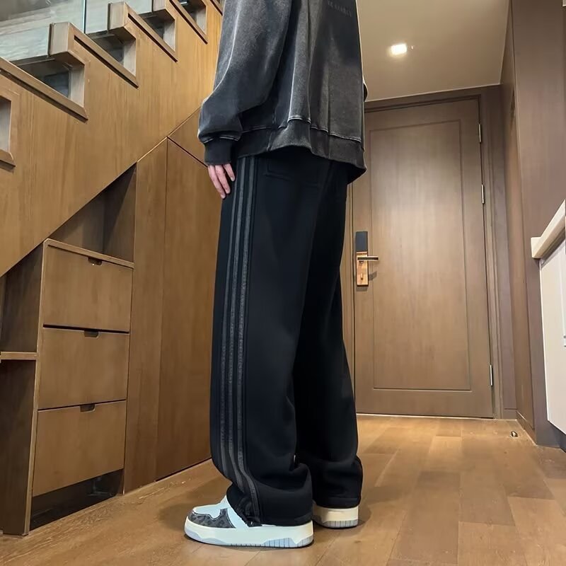中学生向けの春と秋のパンツ、ハンサムなカジュアルパンツ、ティーンエイジャー向けのルーズストレートパンツ、多用途のスポーツパンツ|undefined