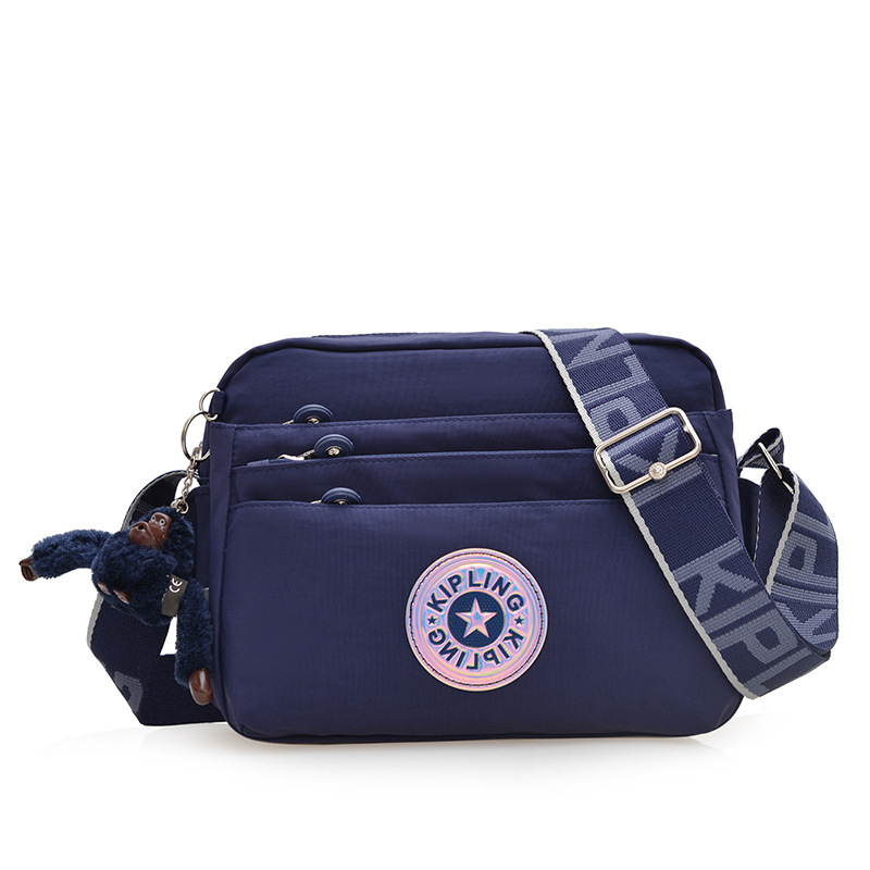 Nuevo bolso de hombro para mujer kp bolso de mensajero de tela de nailon anti-salpicaduras ultraligero nuevo colgante de mono estándar damas compras diagonales