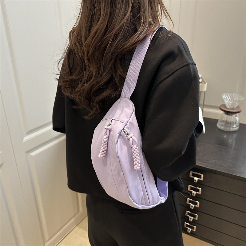 Bolso de hombro casual de lona 2026 verano nuevo estilo de tramo oblicuo bolso de pecho deportivo simple versátil bolso de moda de mujer