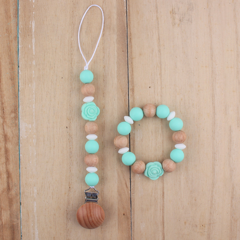 Nuevo bebé de dibujos animados de silicona de doble cara Rosa mordedor calmante bebé anti-gota cadena pulsera traje de juguete