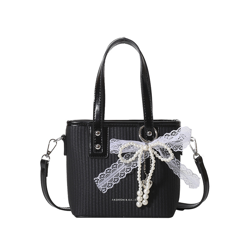 Bolsa de balde de mano caliente de verano para mujeres 2025 nueva bolsa de playa de vacaciones de playa bolsa de tejido bolsa de paja