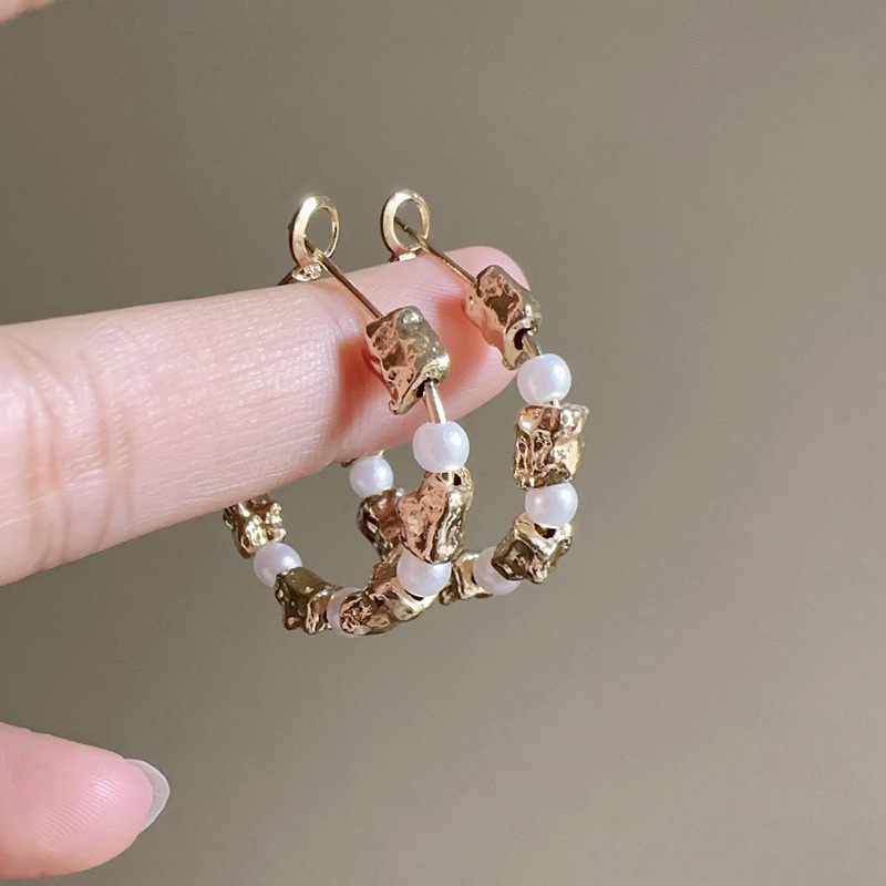 Pair of gold silver needles